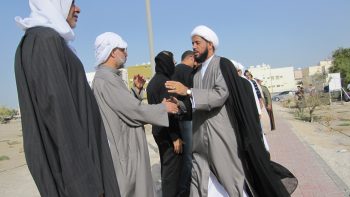 A group of Arab men saying goodbye to each other