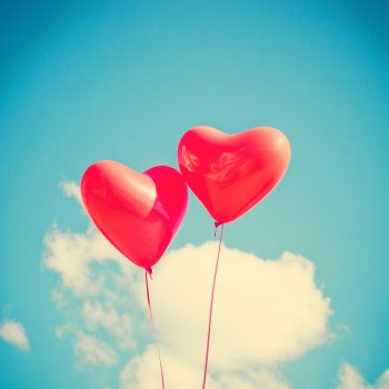 photo of two heart balloons
