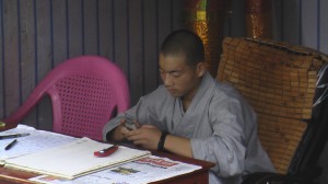 A monk's gotta check his text messages.