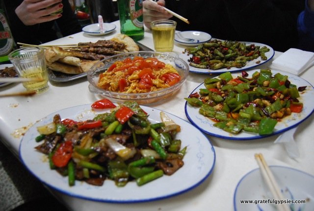 A table full of food in a Xinjiang restaurant.
