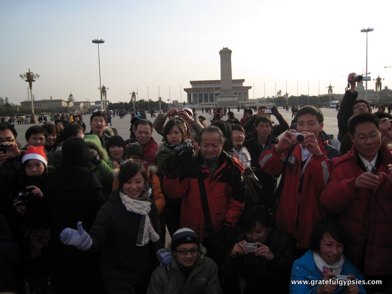 Chinese take photos of foreigners in Tiananmen.
