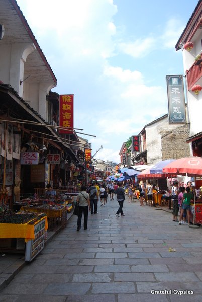 The town's West Street is full of vendors, shops, cafes, restaurants, and bars.