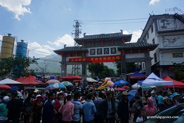 The entrance to the street, packed with people.