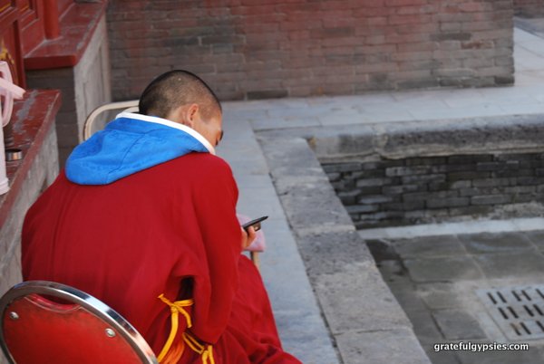 Even monks are on their cell phones!