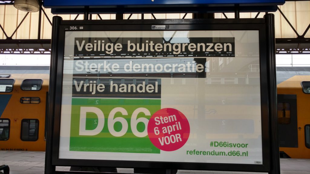 A poster at a train station of political party D66, calling upon voters to vote in favor.