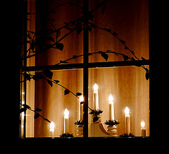 Christmas candles in a window.