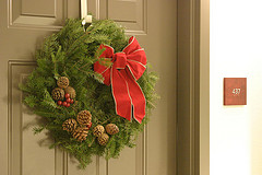 Green Christmas wreath with red bow.
