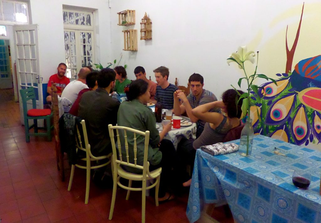 In the hostel in Mexico City where I'm currently living, having dinner at a table with seven nationalities and as many languages. Most of us are practicing Spanish, and many of us have improved our language abilities by making Spanish-speaking friends here in the hostel.