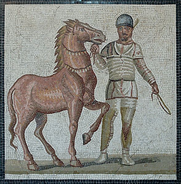 A white charioteer; part of a mosaic of the third century AD, showing four leading charioteers from the different colors, all in their distinctive gear.