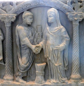 Roman couple joining hands; the bride's belt may show the knot symbolizing that the husband was "belted and bound" to her, which he was to untie in their bed (4th century sarcophagus). Courtesy of WikiCommons & Ad Meskens.