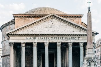 The Pantheon in Rome – a unique building in Roman architecture – has been continuously in use throughout its 2,000-year history. Its dome is still the world's largest unreinforced concrete dome. Along its front, the following is inscribed "M.AGRIPPA.L.F.COS.TERTIUM.FECIT" meaning "Marcus Agrippa, son of Lucius, built this when he was consul for the third time."An example of Classical Latin Alphabet. Photo by Gabriella Clare Marino on Unsplash.