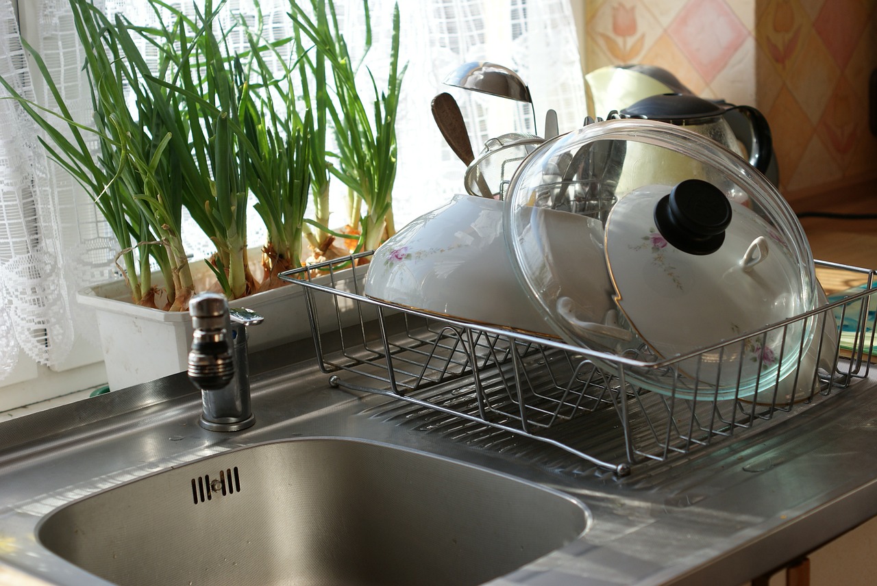 kitchen sink and dishes in strainer
