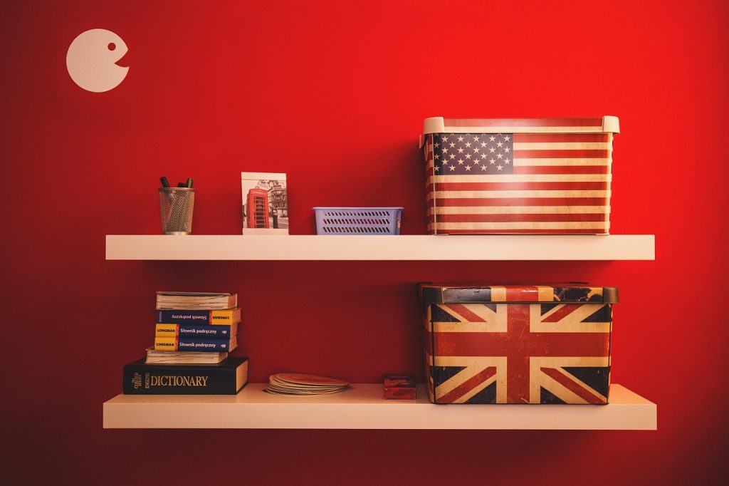 dictionaries and boxes with US and UK flags