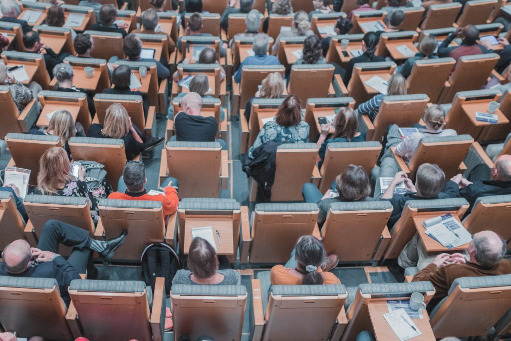 people sitting in an auditorium