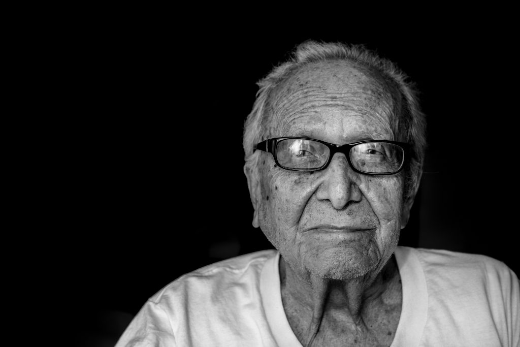 elderly man with glasses