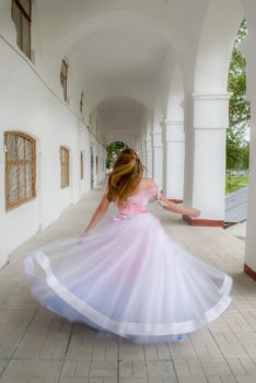 woman-spinning-in-a-beautiful-dress