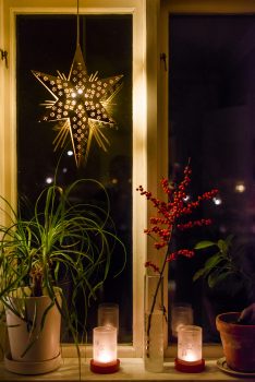 Advent Star and candles in a Swedish window