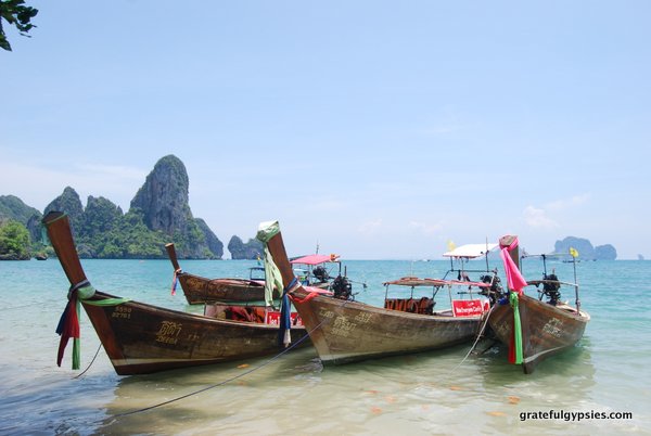 Take a boat ride over to Ton Sai.
